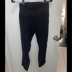 Lululemon black leggings w/ mesh stripes on bottom